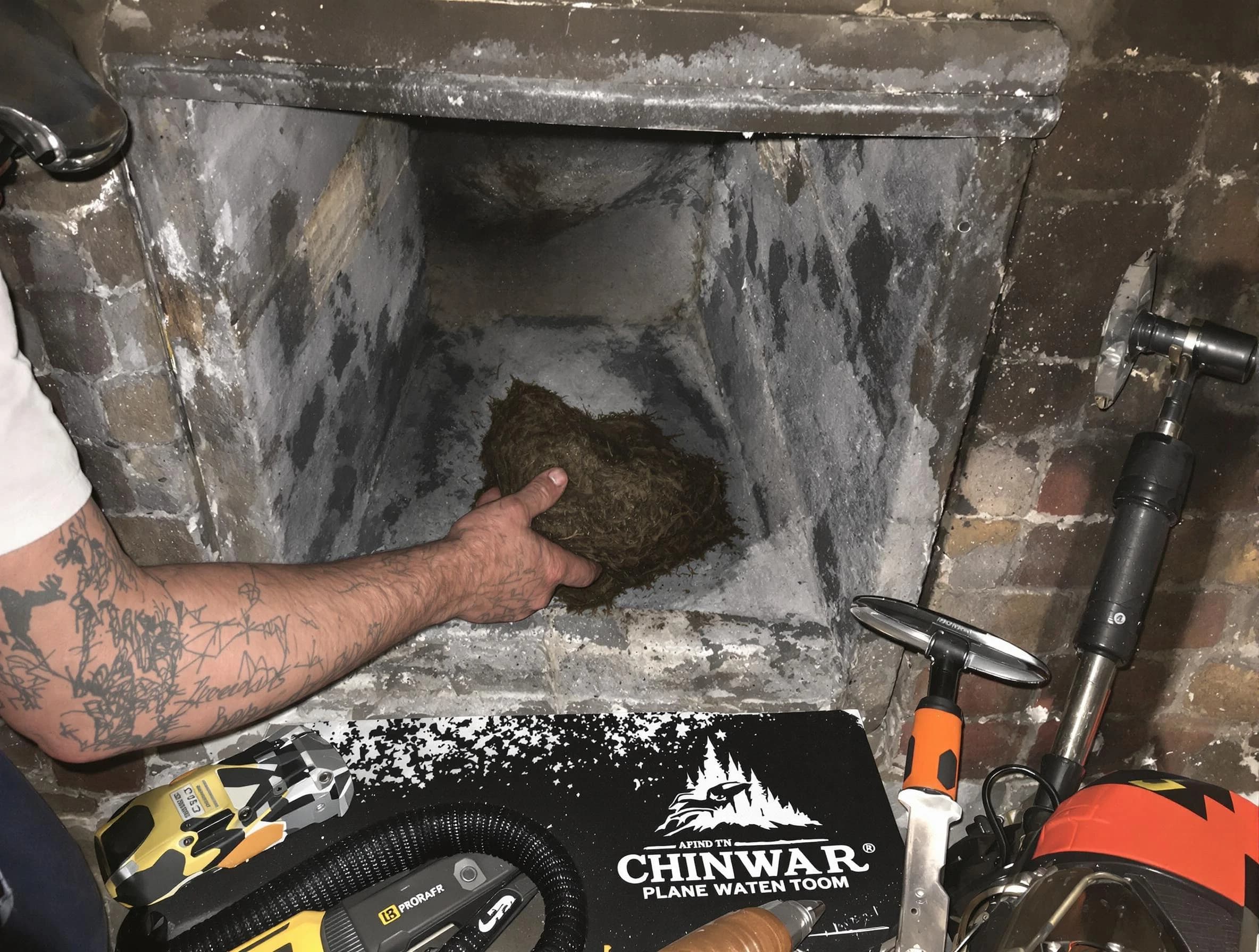 Hapeville Chimney Sweep safely removing debris and screening chimney in Hapeville, GA
